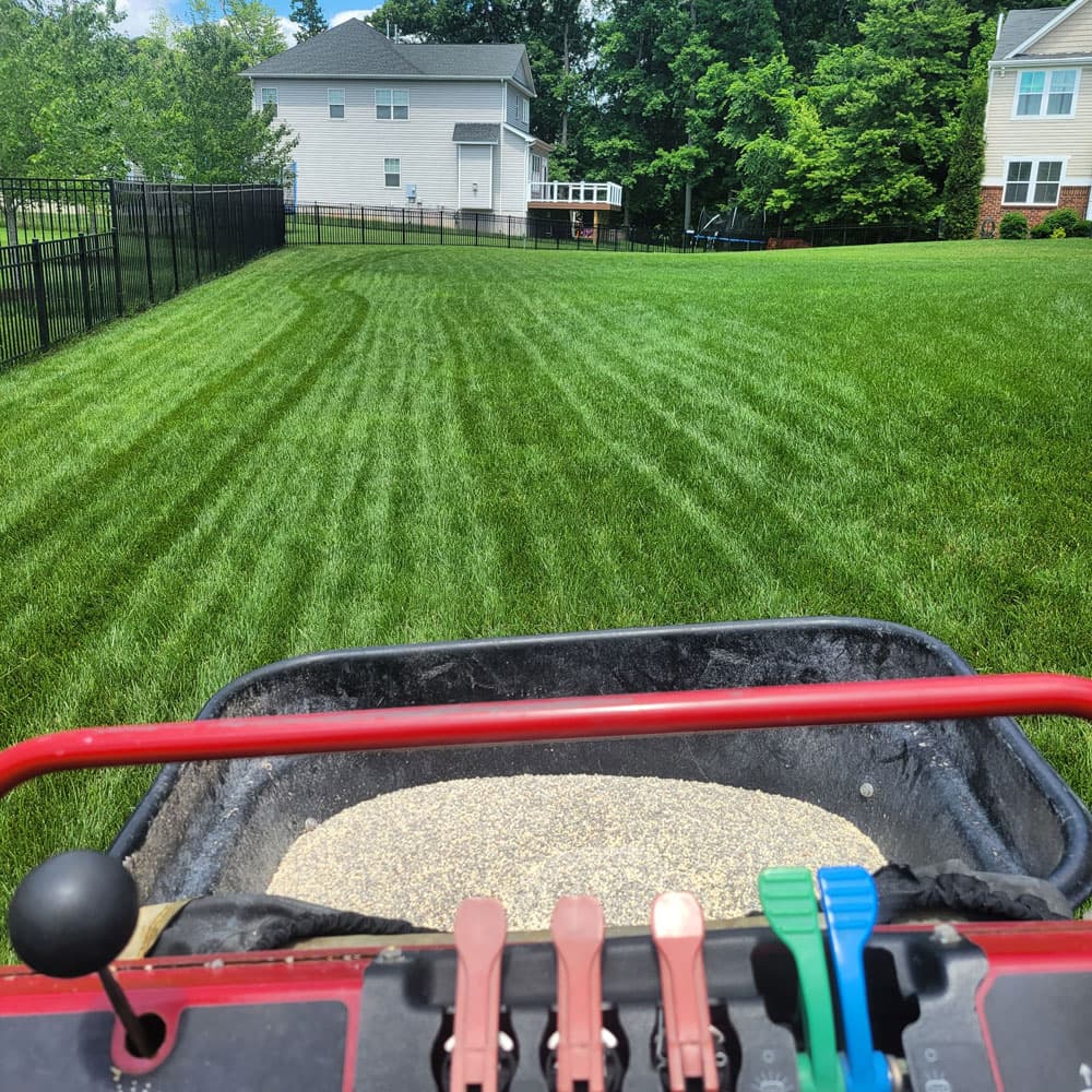 View from a ride-on spreader treating a lawn